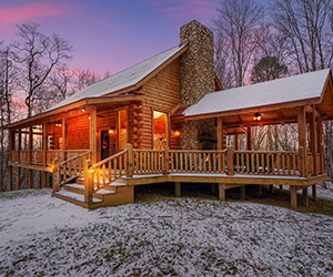 log cabin with side covered patio with jacuzzi