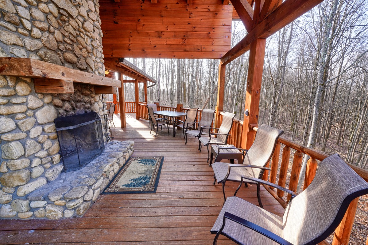 deck with stone fireplace