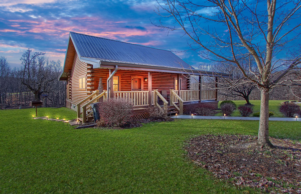 twilight image of log cabin