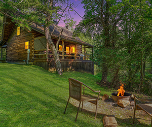 cabin next to pond and lily pads