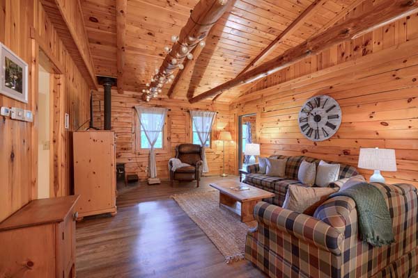 Rustic log cabin interior with wooden beams
