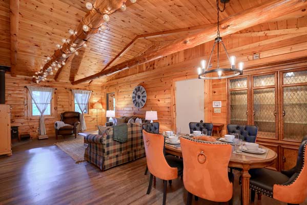 Rustic log cabin dining room with wooden furniture