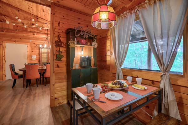 Traditional log cabin dining space with natural light