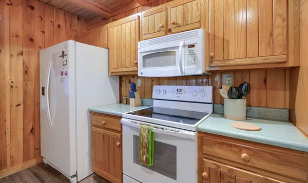 Charming log cabin kitchen with vintage decor