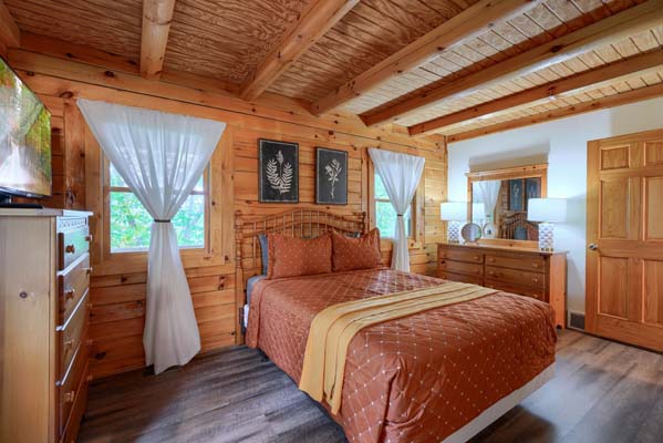 Charming log cabin bedroom with vintage decor