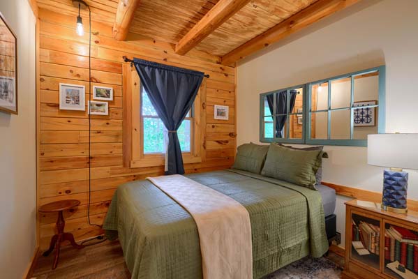 Traditional log cabin bedroom with natural light