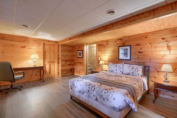 Inviting log cabin bedroom with a comfortable bed