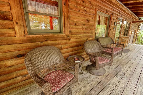 Tranquil log cabin porch surrounded by nature