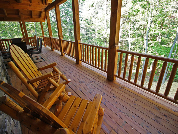 view from porch, tree views, wooden rocking chairs, handrail