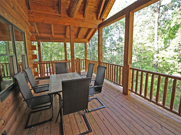 dining table on porch, wooden railing 