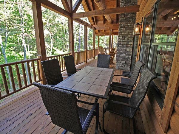 table and six chairs on porch