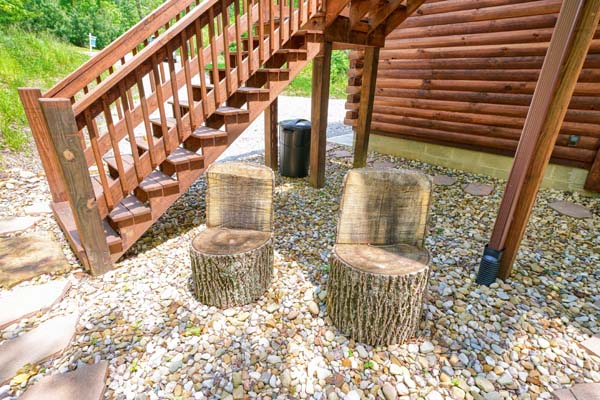 two log seats in gravel