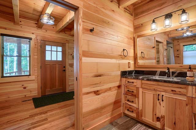Rustic charm of the log cabin bathroom decor
