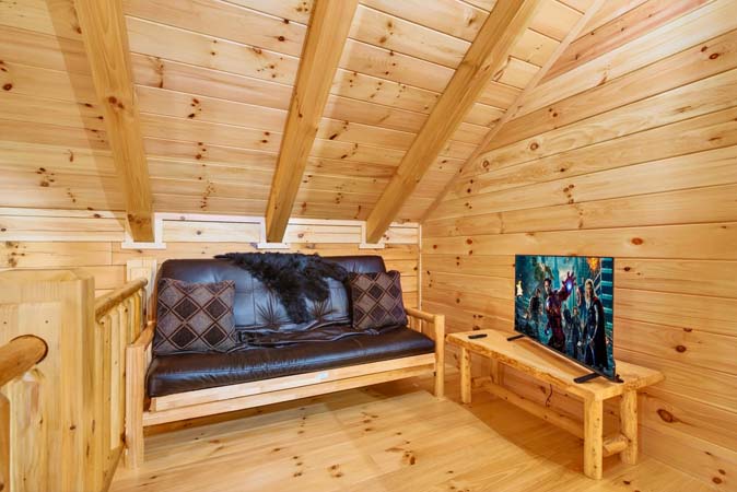 Comfortable seating area inside Happy Hours Cabin