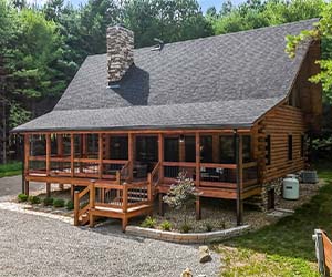 Hidden Pines — secluded Hocking Hills log cabin rental with covered hot tub
