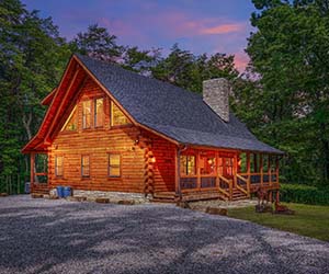 cabin, goat statue, wooded area