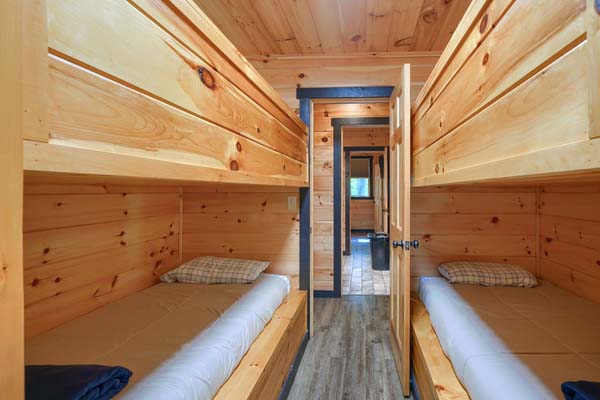two sets of bunk beds in room