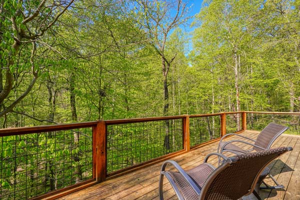 Spacious deck with scenic views on a log cabin