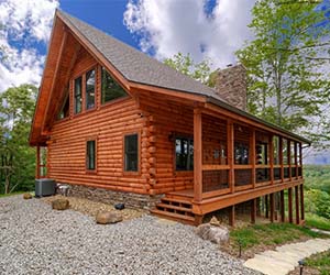 side of cabin with large wooded side