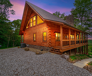 side of cabin with large wooded side