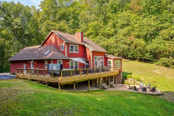 red house with wrap around deck