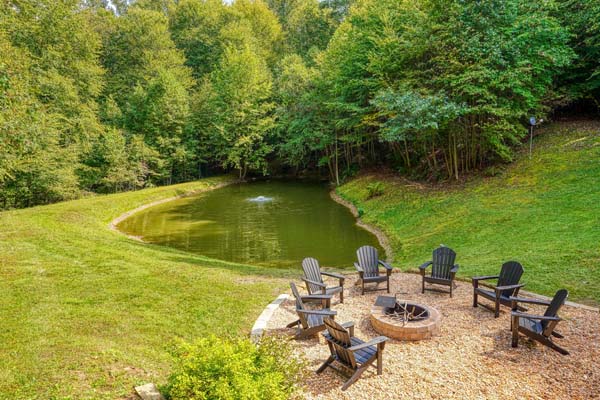 pond and firepit with seating