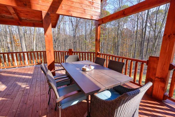 Wooden deck with rustic charm on the log cabin
