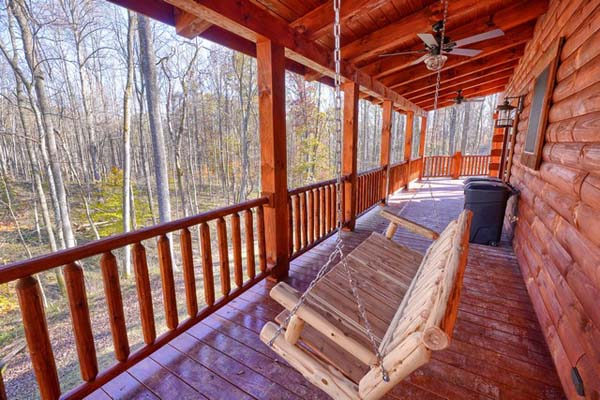 Secluded log cabin deck surrounded by wilderness
