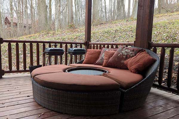 covered deck with patio furniture