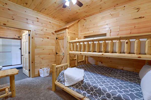 Rustic elegance of the log cabin bedroom with bunk beds