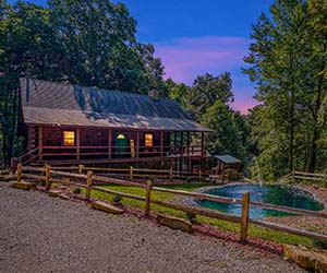 two story log lodge style wrap around deck