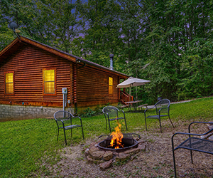 side view of cabin with covered porch