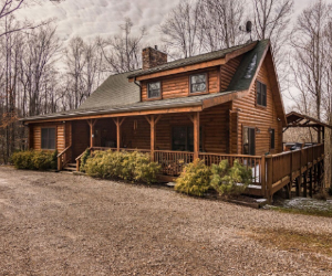 lodge style cabin, two story with wrap around deck