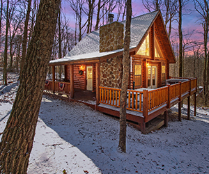 stone fireplace on front porch with side deck and jacuzzi
