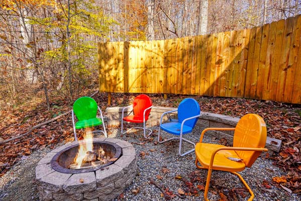 firepit with colorful chairs
