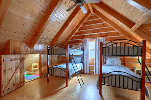 two sets of bunk beds in bedroom
