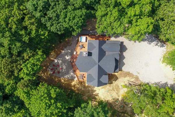 drone view cabin in woods