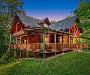 green roof, wrap around deck on slated hill