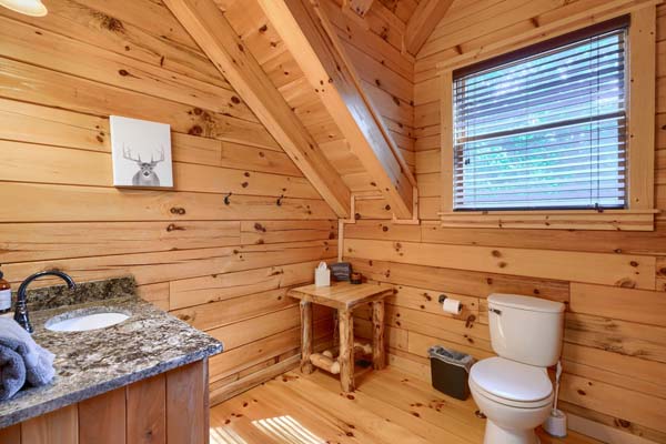 Quaint and comfortable log cabin bedroom