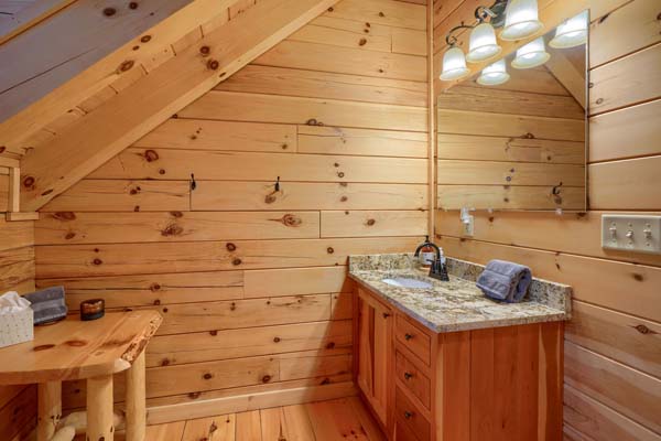 Relaxing log cabin bathroom with nature-inspired element