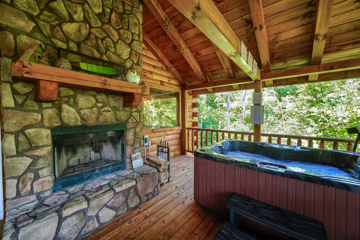 stone fireplace and hot tub