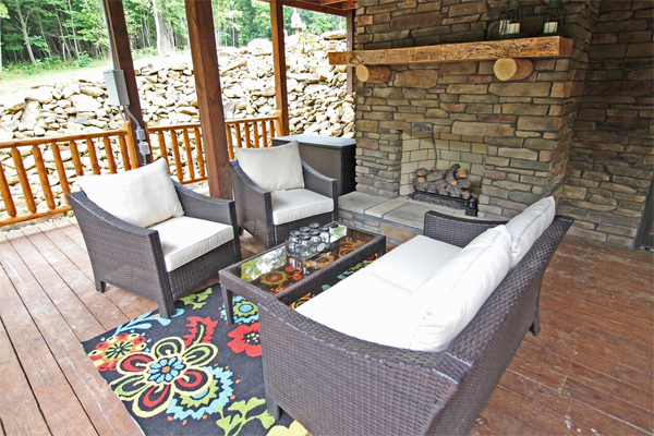 patio furniture and fireplace on deck