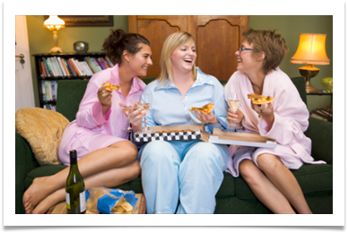in cabin spa services ladies laughing while sitting on sofa