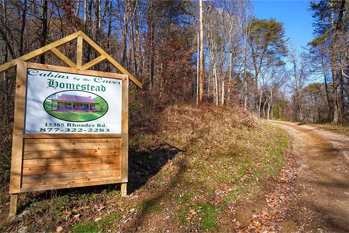 cabins by the caves sign