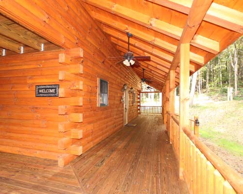 Scenic log cabin deck overlooking nature"