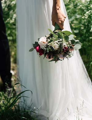 Pure & Simple Wedding Package holding flowers
